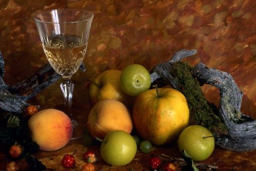 White wine and fruits isolated on painted background