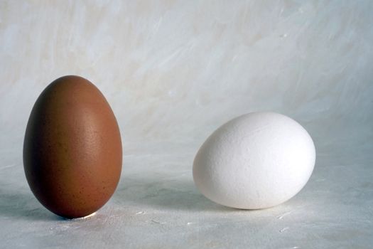 Two red and white eggs isolated on painted background