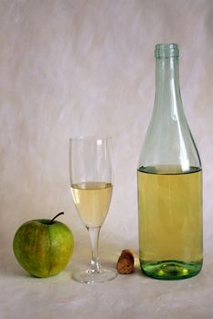 White wine and apple isolated on painted background