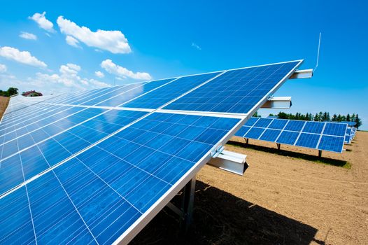 Solar Energy Farm with blue Sky and some Clouds