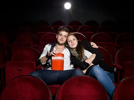 Young couple alone at the Movie Theater