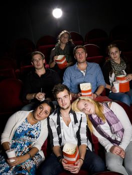 Young man with two women at the movie theater