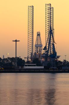 Construction- and ship-repair industry - Drilling rig in dock by evening light