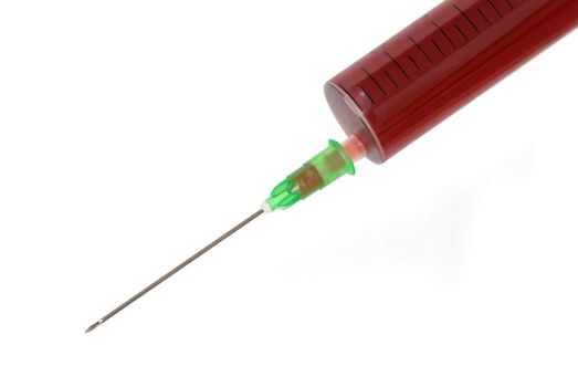 A syringe filled with blood or red fluid