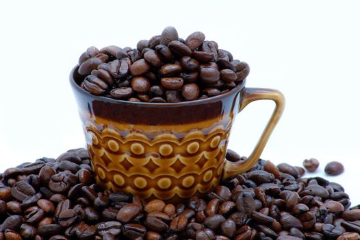 cup with coffe beans isolated on the white background