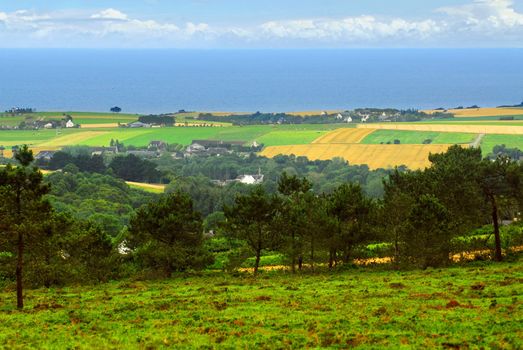 Agricultural landscape with scenic ocean view in rural Brittany, France