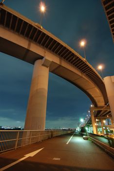 wideangle night image of well and high density organized Japanese urban roads area close to Arakawa river embankment, Tokyo, Japan