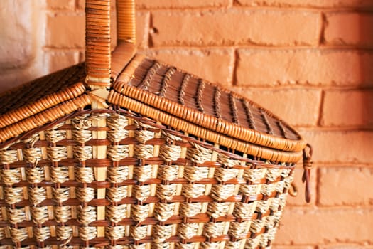 part of basket on terra-cotta wall background. close-up