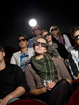 Spectators with 3d glasses on the movie theater