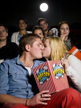 Young couple on a date at the movie theater