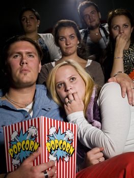 Young couple on a date at the movie theater