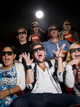 Scared Movie spectators with 3d glasses