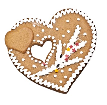 On a white background Christmas ornament gingerbread heart-shaped.
