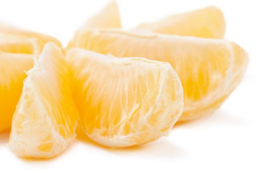 Closeup view of tangerine sections isolated on the white