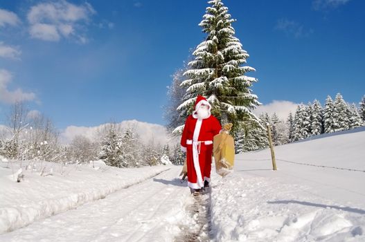 Santa Claus, Father Christmas in a beautiful winter landscape