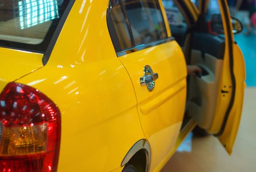 Yellow car on display at the exhibition