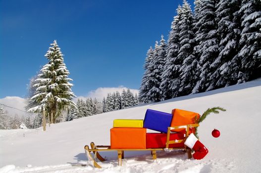 colorful presents on a Santa Claus sledge in a winter landscape