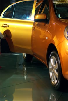 Yellow car on display at the exhibition