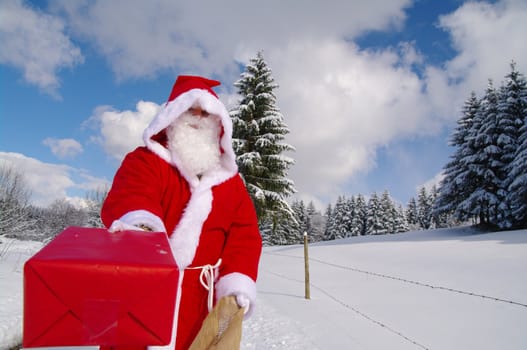 Santa Claus, Father Christmas holds red present