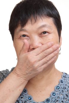 old woman covering her mouth