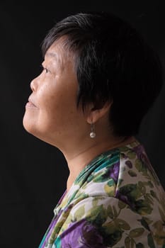 asian woman on black background 