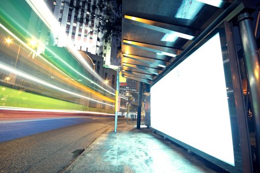 white display advertising with traffic at night 