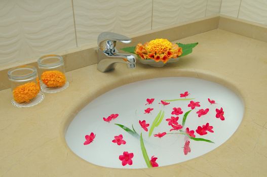 Decoration bathroom in the hotel. Flowers and suds.