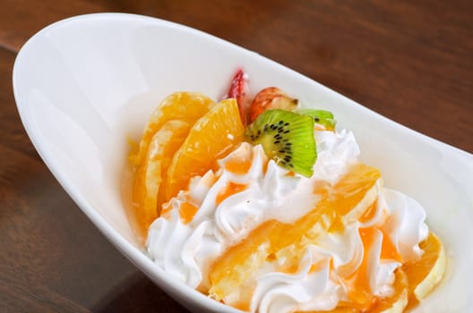 Ice cream dessert with kiwi, strawberry and orange