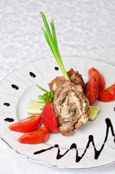 Pork rolls with cheese and vegetables: onion, cucumbers, tomatoes
