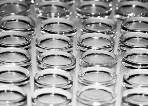 Abstract monochrome showing detail of glass tumblers