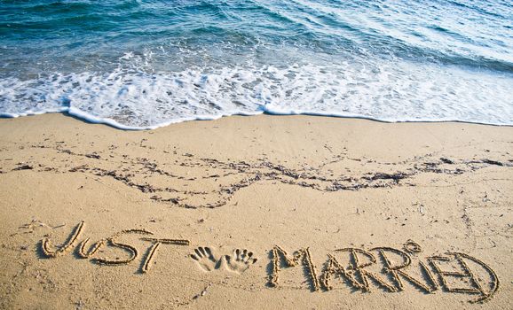 Just Married written in the Sand on the Beach