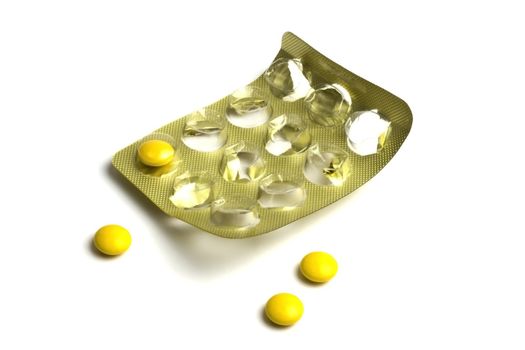 Package of Yellow Pills isolated on white