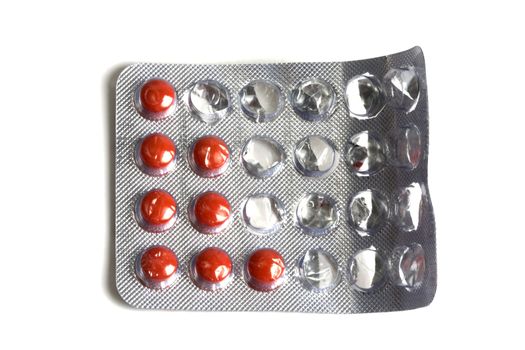 Set of red pills isolated on white
