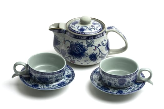 Chinese tea set with pot and cups isolated on white