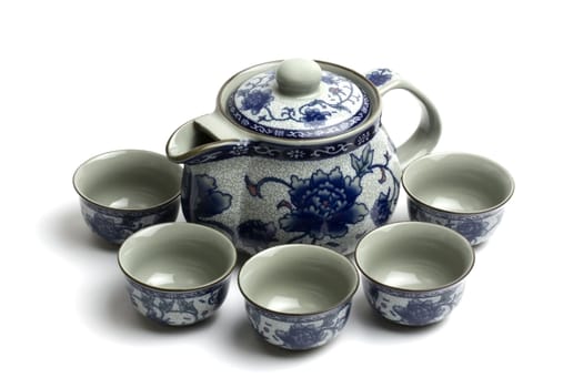 Chinese tea set with cups and tea pot isolated on white