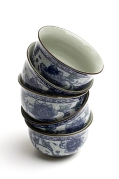 Few chinese tea cups isolated on white 