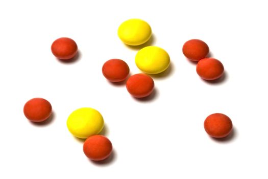 Red and yellow pills isolated on white background