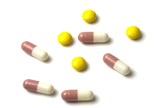 Colourful pills isolated on white background