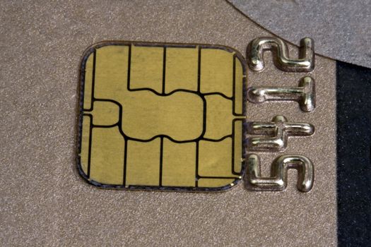 Gold chip of a credit card closeup