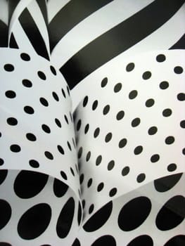 Closeup black striped and polka dot background