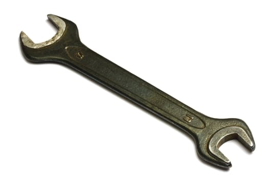Rusty and black wrench isolated on white background