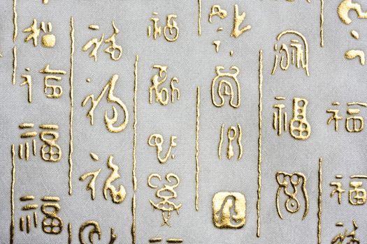 Chinese words on fabric background closeup
