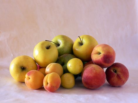 Multi fresh fruits isolated on painted background