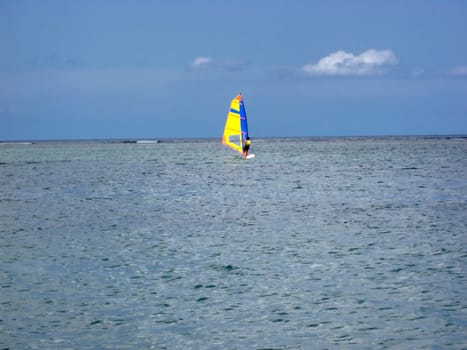 Windsurfing in calm ocean of Mauritius