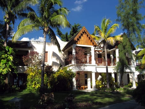 Exotic Holiday house in Mauritius with Coconut trees and blue sky