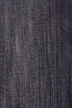 Texture of black jeans background closeup