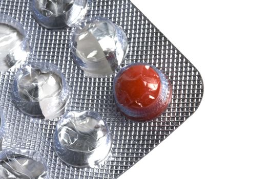 One red pill isolated on white background