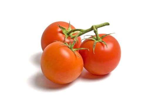 Three fresh tomatoes isolated on white background