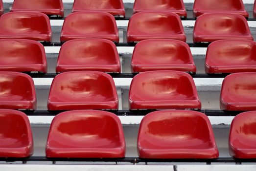 Red bleachers in areana, Thailand.