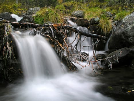  Flowing water from a small waterfall in mountain